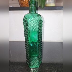 Vintage tall glass bottle